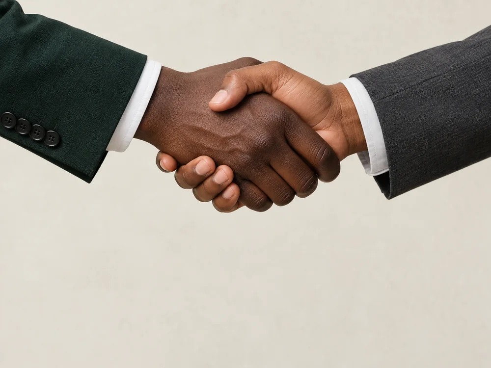 Two partners greeting with a handshake